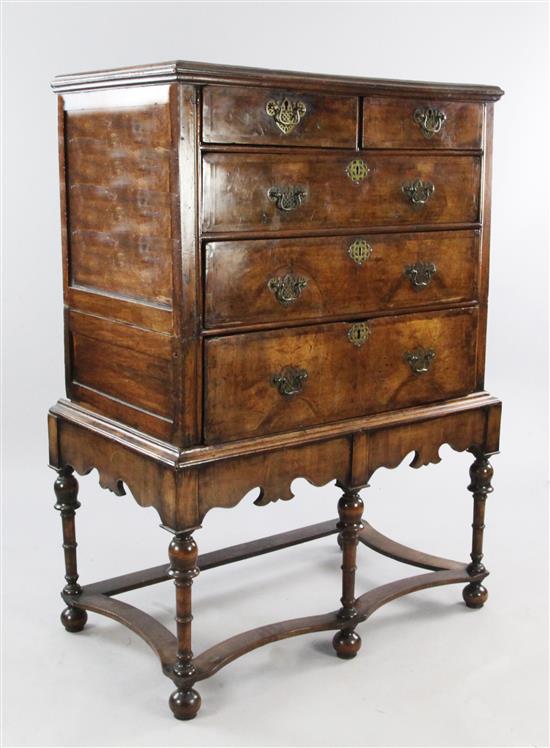 An 18th century walnut featherbanded chest on stand, W.3ft 1in.